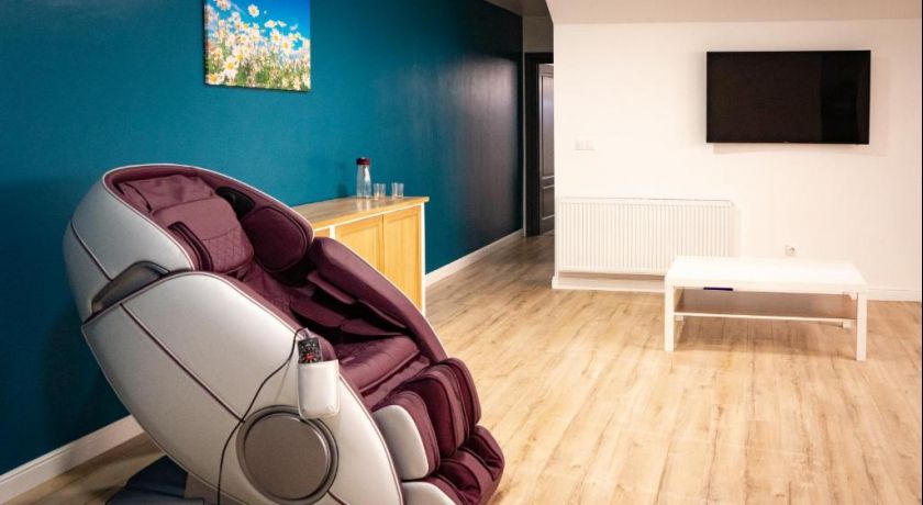 Apartamentul · Zona de relaxare și fotoliul de masaj